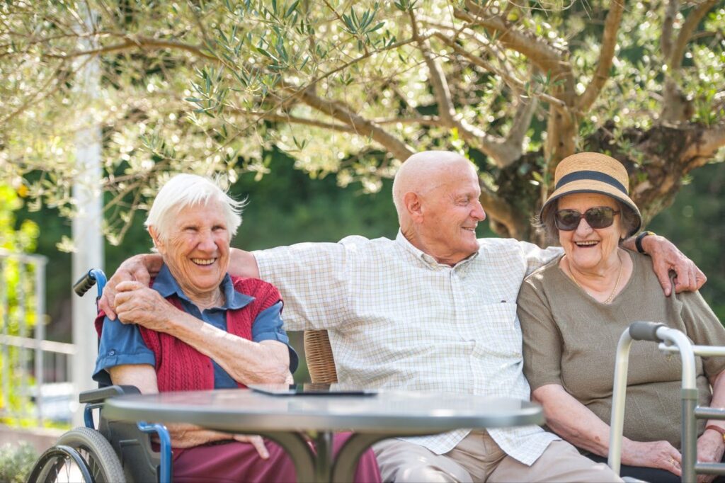 Group of seniors talking and laughing in the park