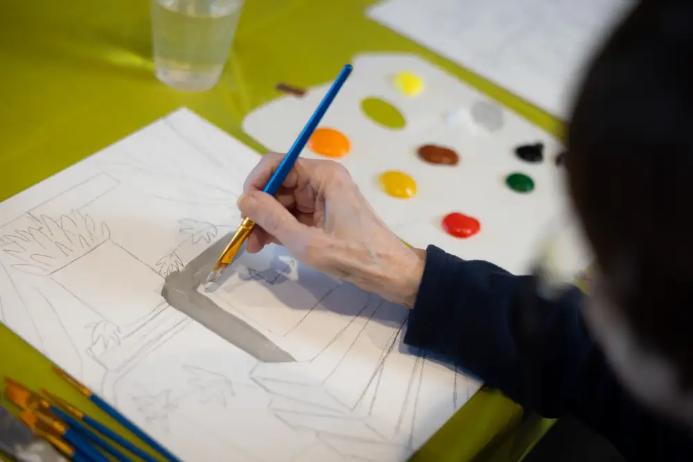 Delaney At The Green resident painting with water colors