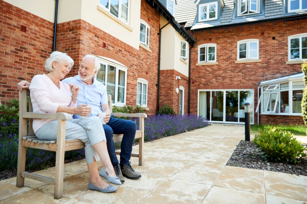 A senior man talking to his wife about what to look for in memory care at a senior community like: Delaney at The Green in Florham Park, NJ.
