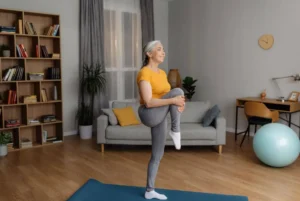 A senior woman stretching and doing mobility exercises for seniors to help improve independence.