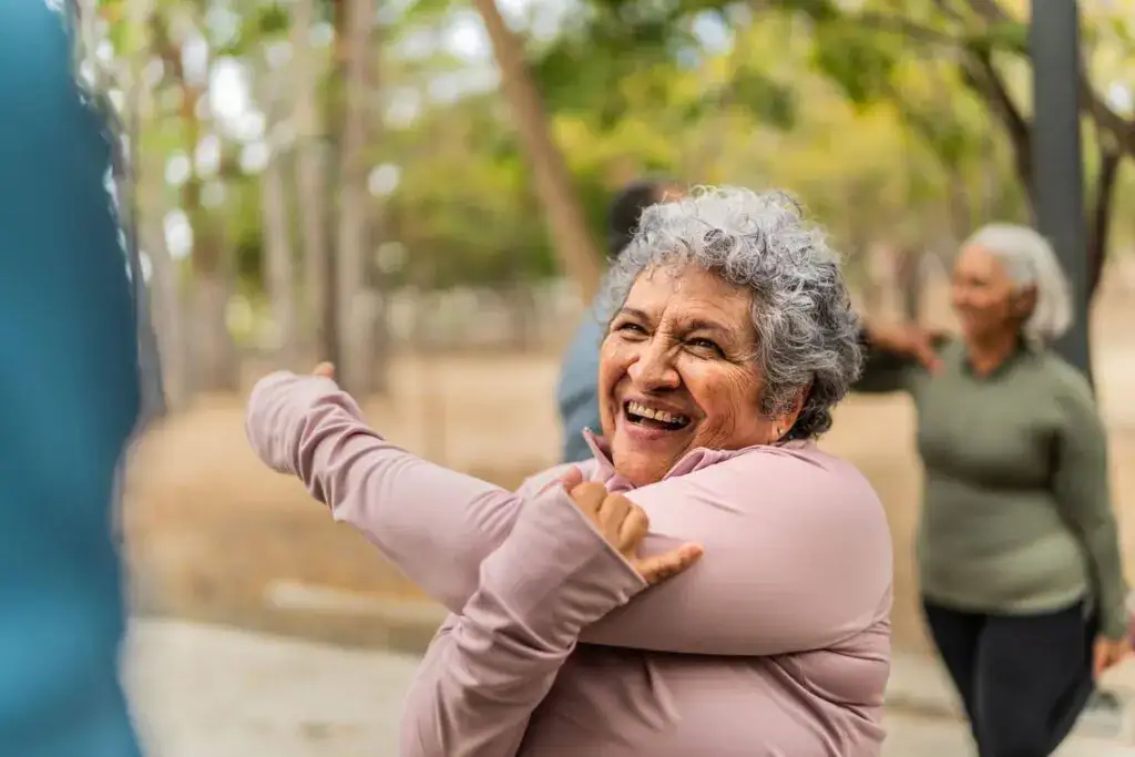 A senior woman stretching and getting in everyday movement as a part of mobility exercises for seniors that help maintain independence in Florham Park, NJ.